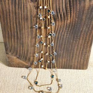 3 layer gold necklace with blue stones